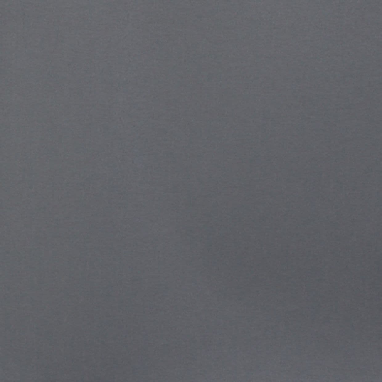 Smooth matte gray wall filling the frame, unadorned and uniformly lit; appearing static and featureless, suggesting a minimally furnished interior with soft, diffuse ambient lighting.