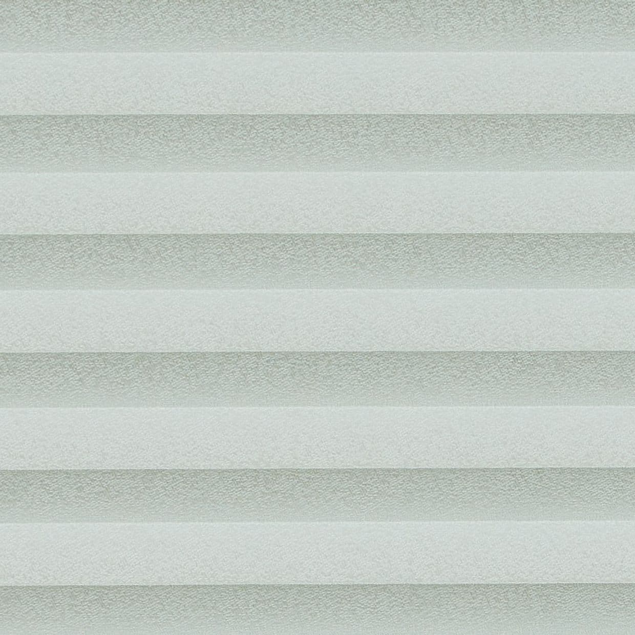 Cellular pleated blinds, fully lowered with evenly spaced pale gray-green horizontal bands, filtering diffuse daylight across a neutral interior and creating soft, uniform illumination.