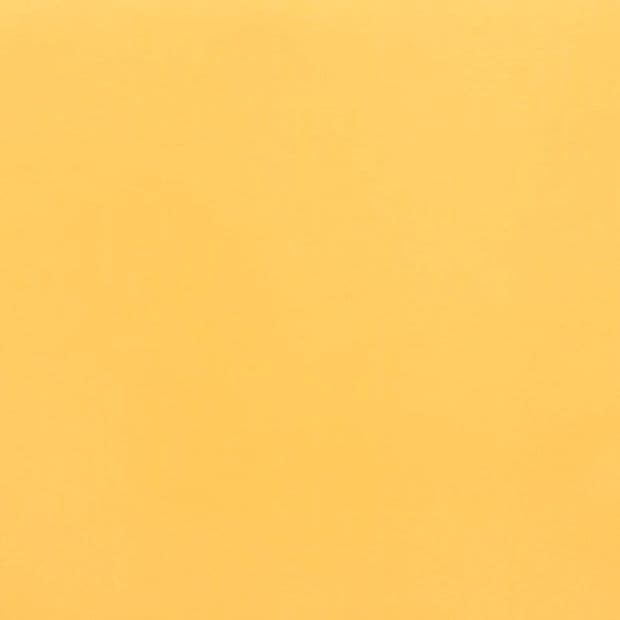 Solid pale orange sheet filling the frame, lying flat and motionless; evenly lit with subtle texture, minimal studio backdrop.