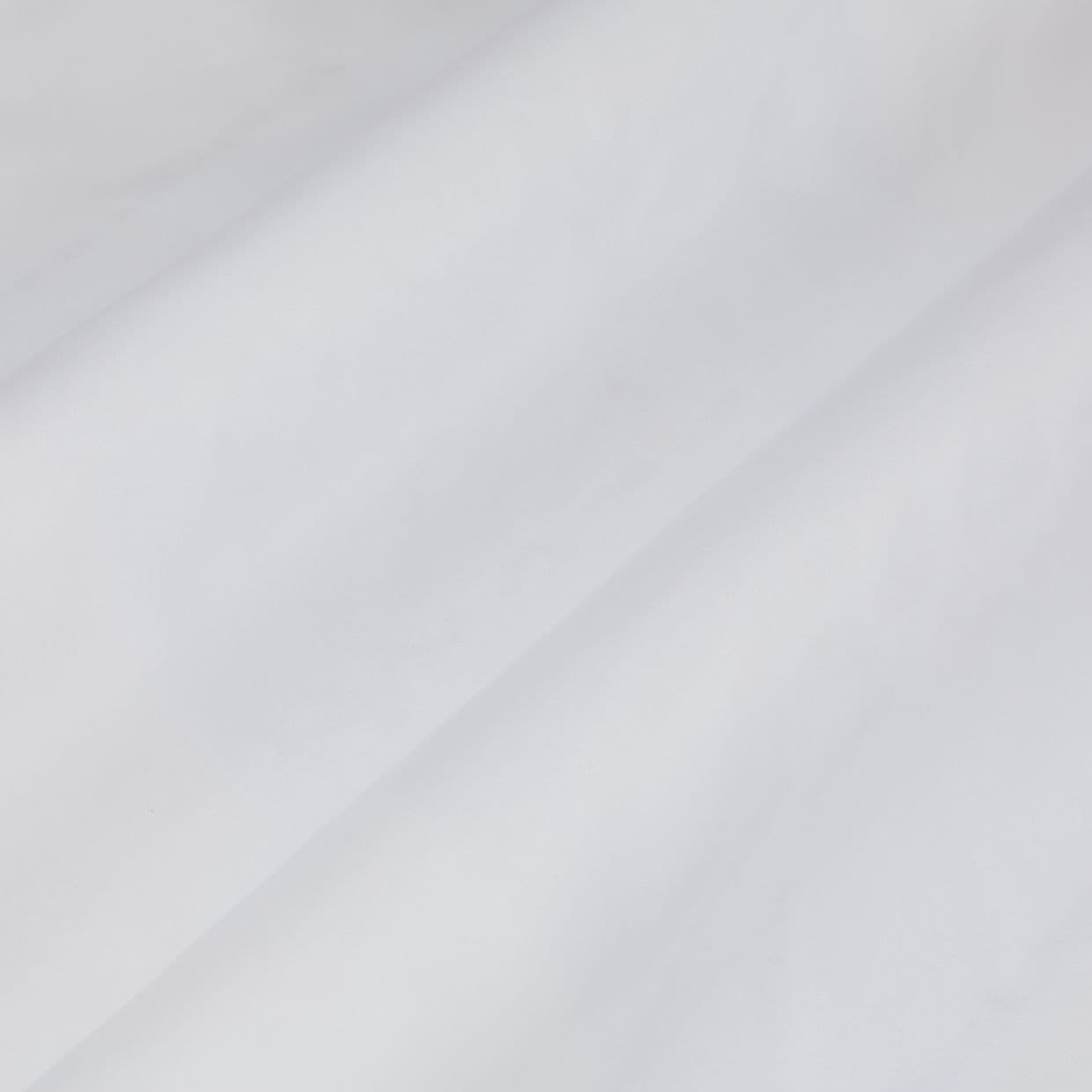 White fabric with a prominent diagonal fold, draped smoothly across the frame showing soft creases; close-up view under diffuse, neutral lighting with no visible surroundings.