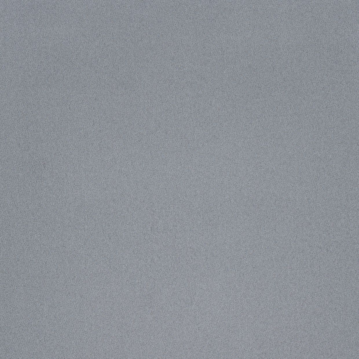 A coarse grey fabric surface (no curtains or blinds), filling the frame; texture appears densely stippled and static, lying flat under even, neutral indoor lighting with no visible context.