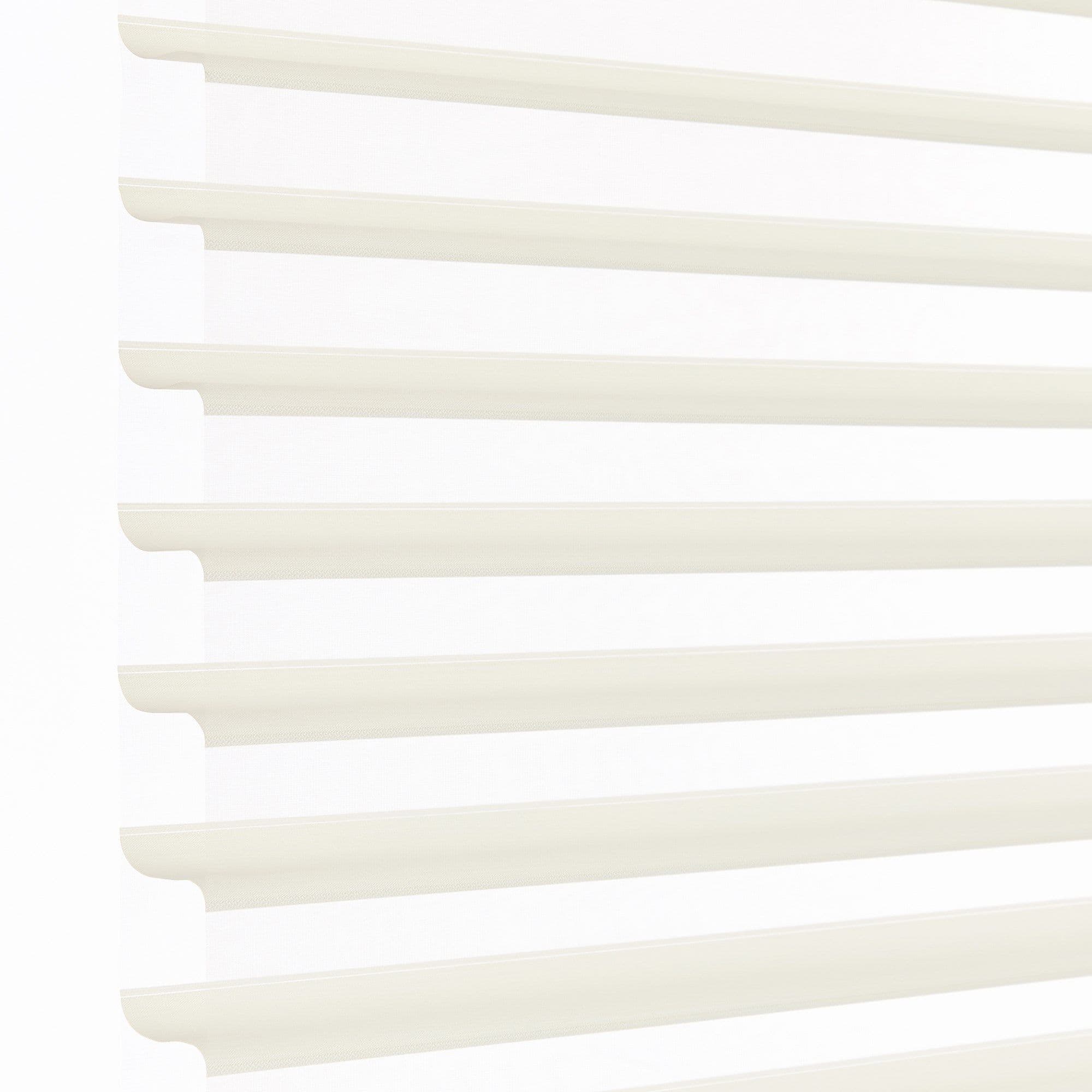 White layered zebra blinds with horizontal opaque slats and sheer panels, mounted left, covering window; slats angled to filter bright daylight into a minimally visible, softly lit interior.