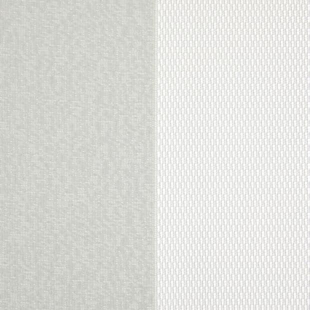 Two vertical fabric panels (curtains): left opaque light gray textured, right sheer white with small rectangular pattern; both closed, gently filtering diffuse daylight in a neutral-lit interior.