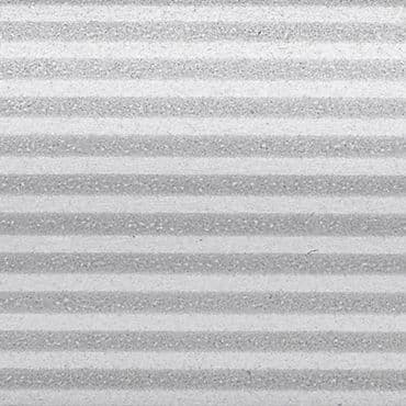 Horizontal pleated blinds, closed, showing alternating light and dark textured bands; filtering soft diffuse light; close-up view filling the frame, neutral grayscale tones suggesting indoor lighting.