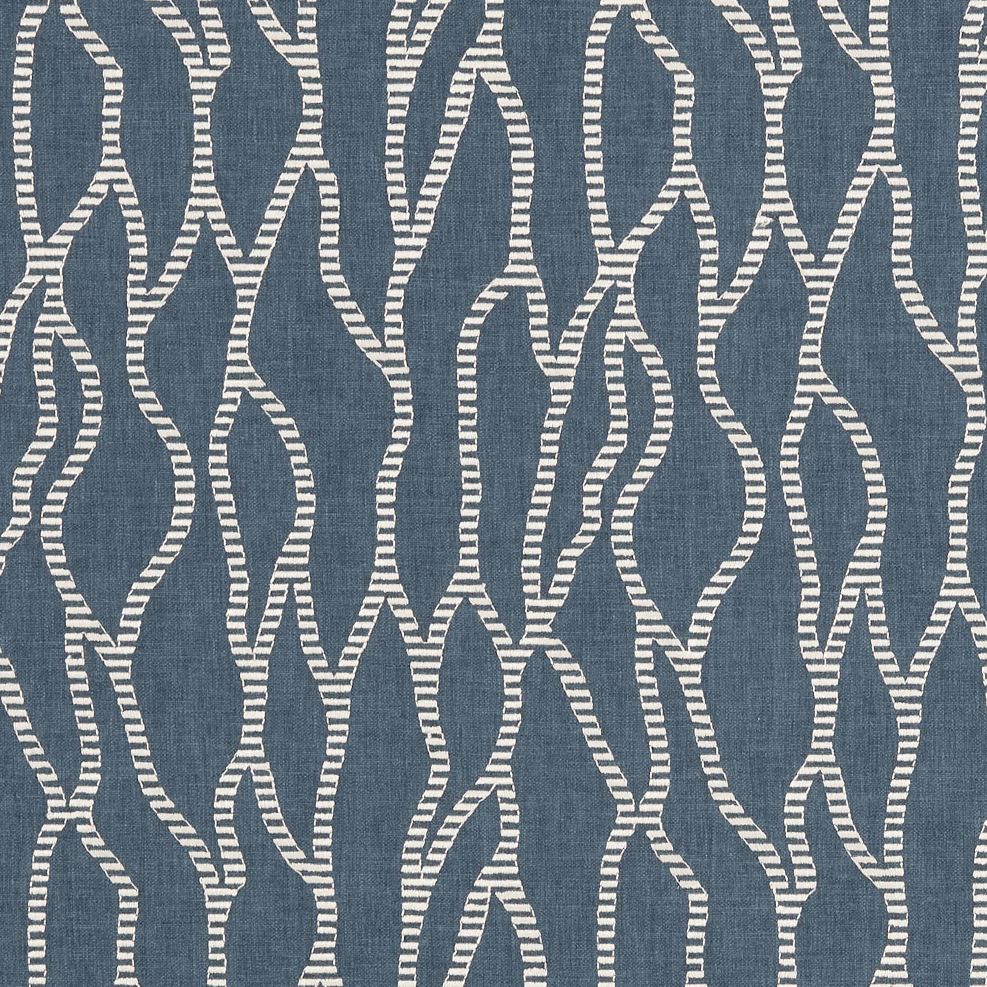 Woven textile featuring repeating vertical, meandering white striped lines with a stitched look â€” covering the surface against a muted denim-blue background in a flat, close-up, evenly lit view.