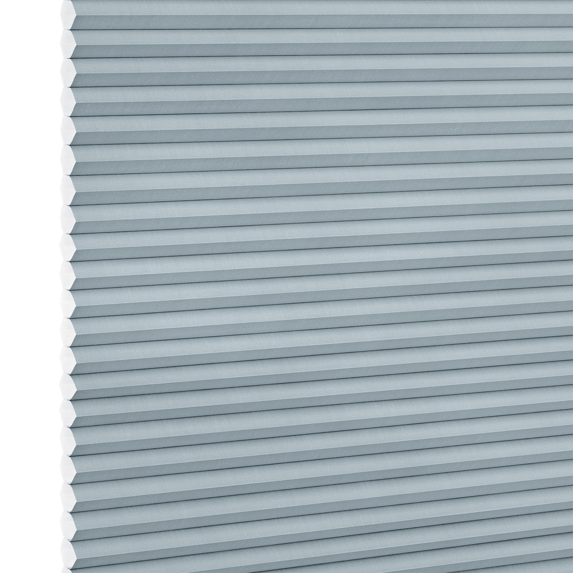 Light-blue cellular (honeycomb) blind, fully lowered with horizontal pleats and hexagonal cells visible at the left edge; blocking light in a close-up view against a white background.