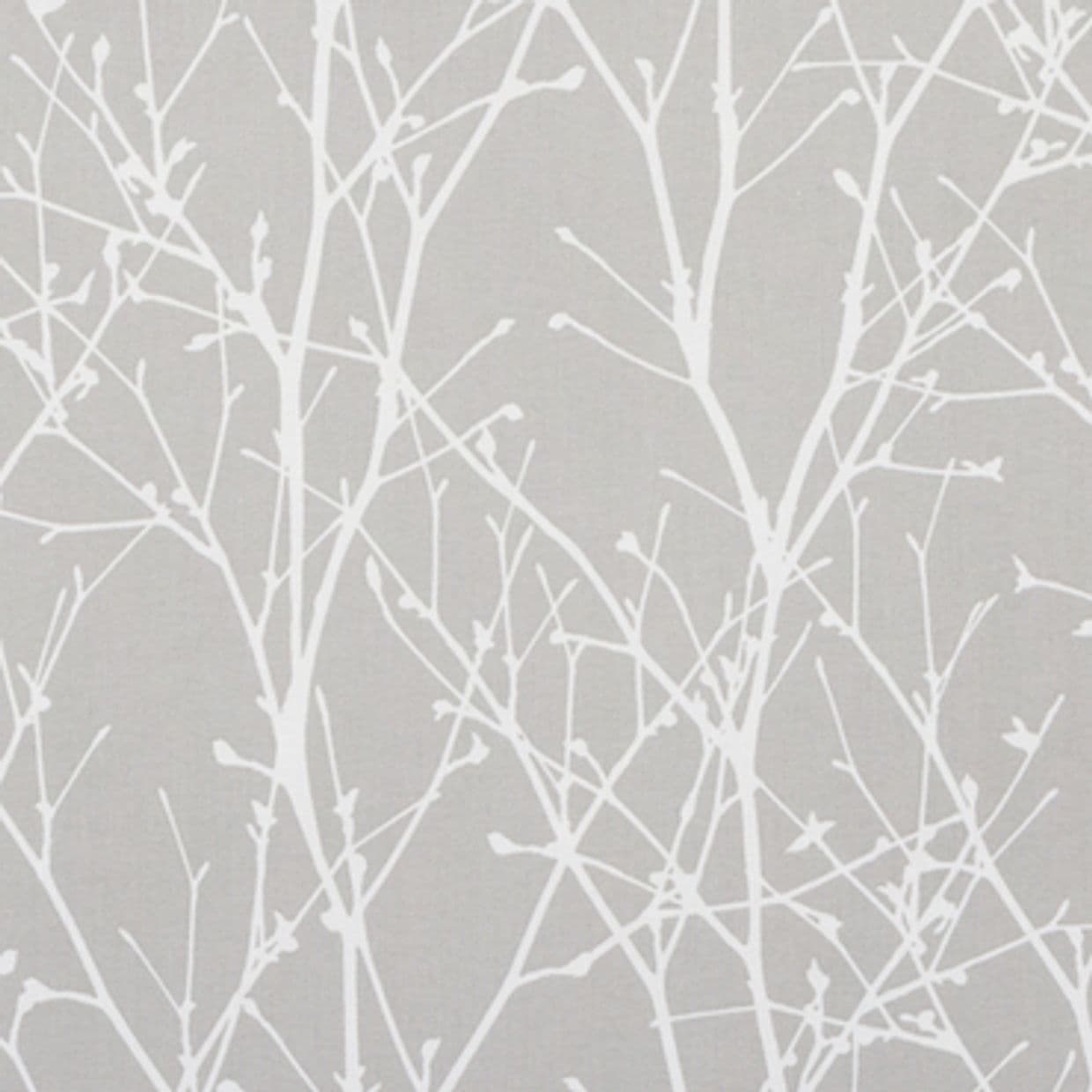 Grey fabric or wallpaper covered in white, leafless twig silhouettes; pattern repeats uniformly, lying flat and static against a smooth surface in a neutral, evenly lit indoor setting.