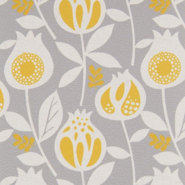 Decorative fabric or wallpaper with stylized yellow-and-white floral motifs â€” repeating pattern across the surface â€” flat close-up, evenly lit, light-gray background.