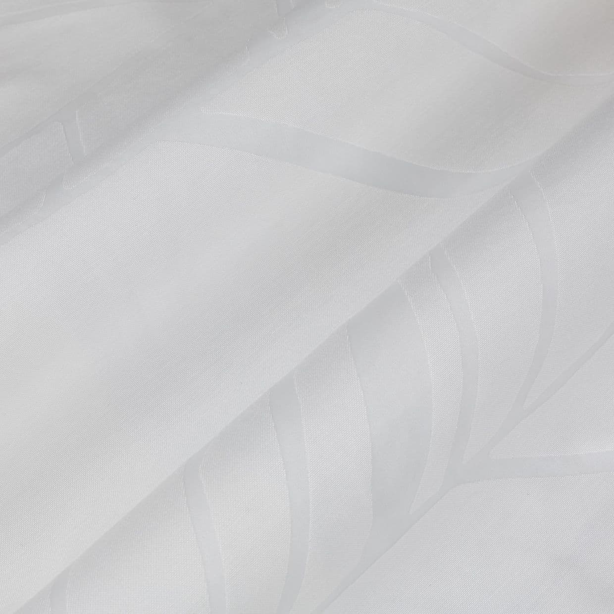 Sheer white curtain panels hung closed, satin-striped with subtle leaf-wave motifs, layered and slightly folded â€” filtering soft daylight in a bright, minimal interior setting.