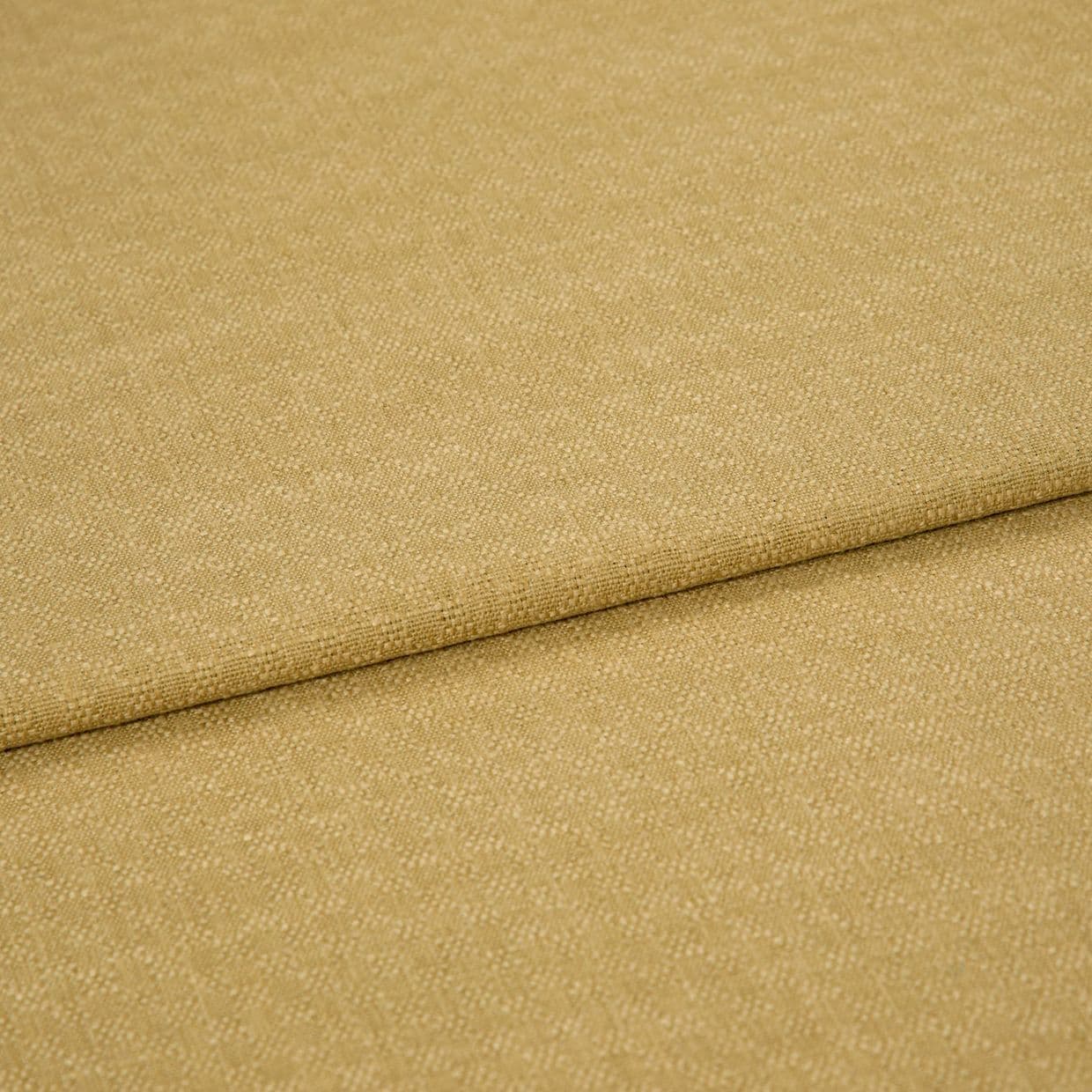 Beige woven fabric with fine pebble texture, folded once creating a horizontal overlap; close-up studio product shot with soft, even lighting showing fabric surface and seam detail.