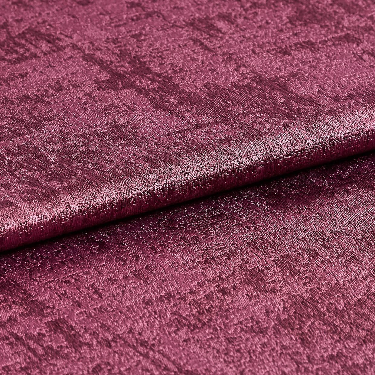 Crushed velvet fabric swatch, folded across the frame with a subtle roll, shimmering and reflecting light; deep magenta color, close-up studio shot emphasizing soft, textured pile.