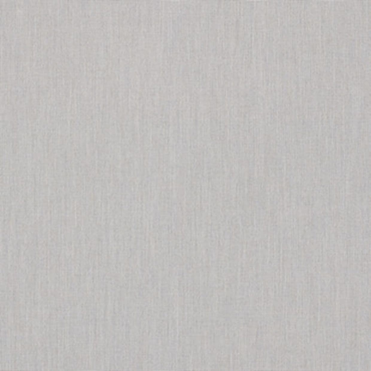Light-gray woven fabric wallpaper covers a wall; its subtle vertical texture lies flat and unblemished, softly illuminated by diffuse light, suggesting a neutral, minimal interior surface.