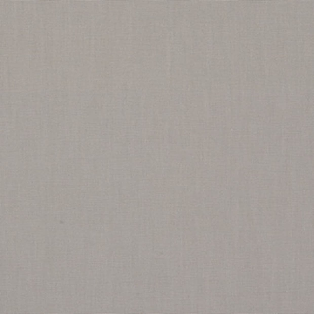 Linen-textured beige fabric panel fills the frame, lying flat and unwrinkled; soft, even lighting reveals a subtle woven pattern across the surface.