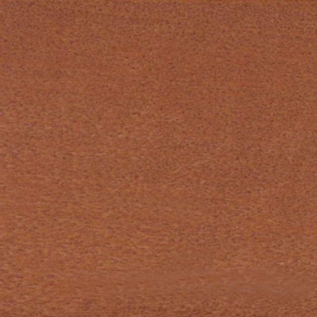 Coarse brown textured fabric occupying the entire frame; lying flat and uniform, appearing like carpet or upholstery under soft warm lighting with no other visible objects or features.