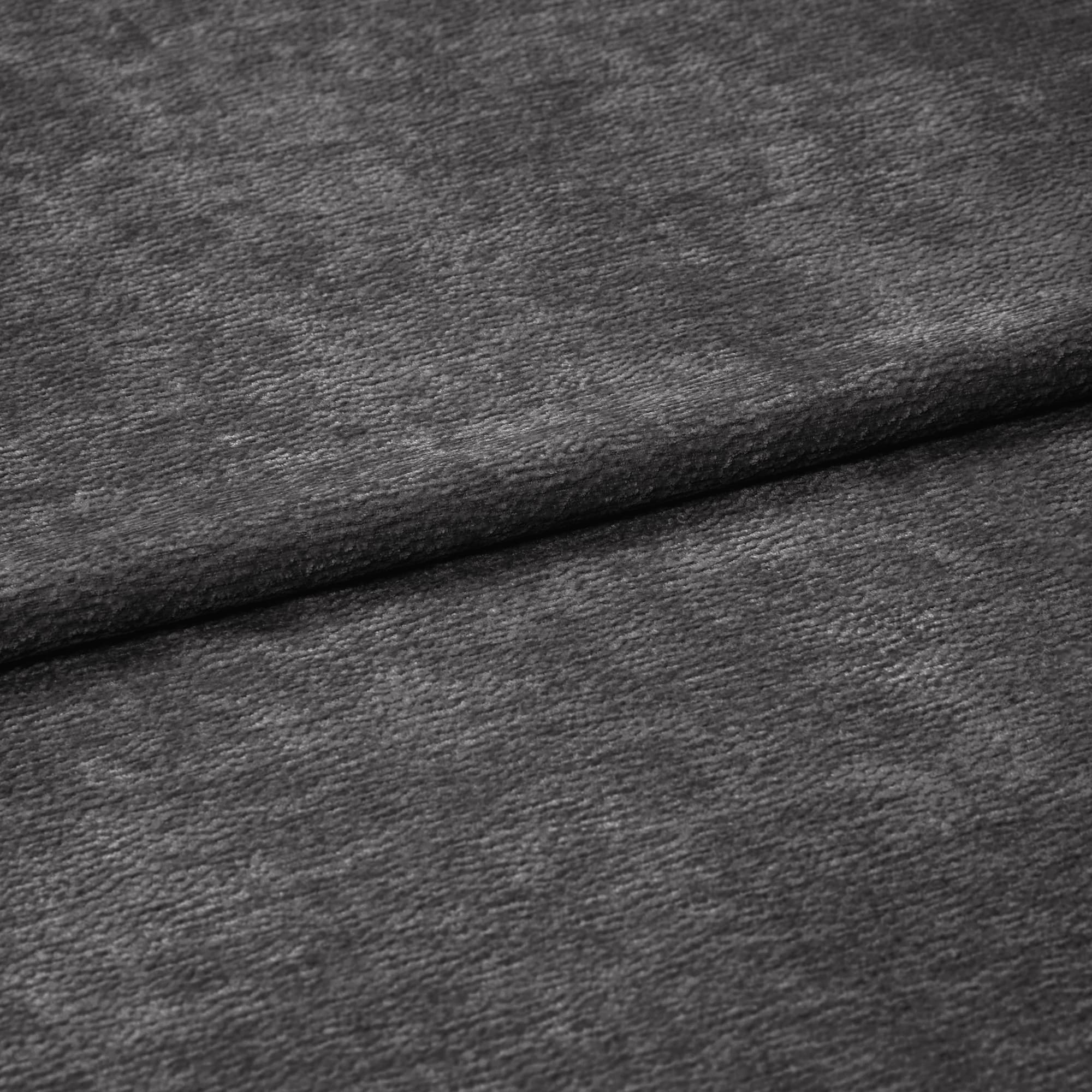 Charcoal-gray, soft-textured fabric (velvet-like) folded in a horizontal overlap, exposing fine nap and subtle sheen; close-up, evenly diffused lighting, neutral background suggesting a fabric sample.