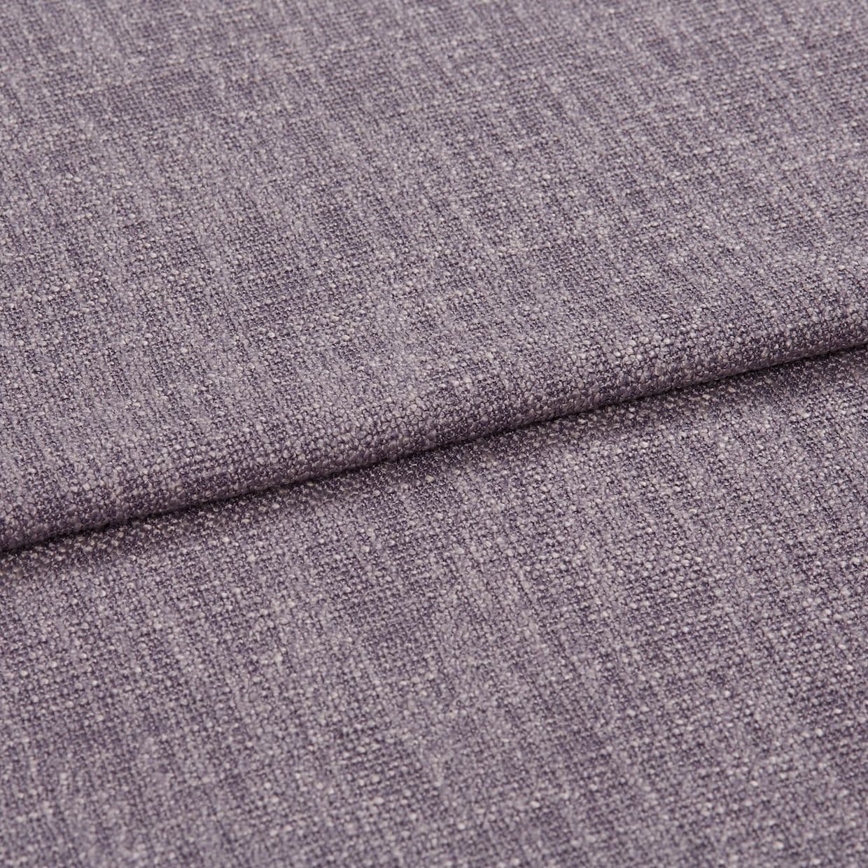 Textured mauve upholstery fabric folded once, showing woven looped weave and subtle sheen; even diffuse lighting on a flat surface, neutral background, no other objects.