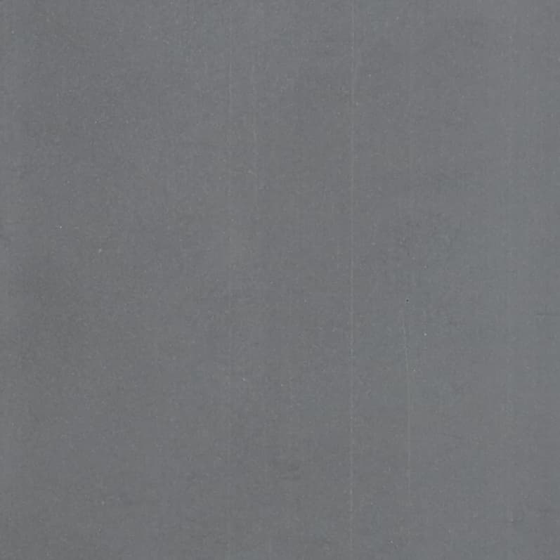 Plain gray surface (fabric or paper) with faint vertical creases and light speckling; filling the frame, static; evenly lit close-up, neutral background.