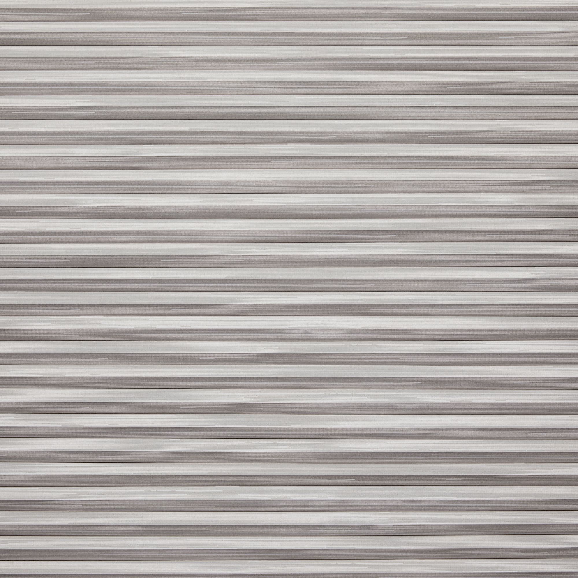 Horizontal slatted roller shutter (narrow, textured beigeâ€‘gray metal slats) â€” fully closed, overlapping â€” blocking light and view across a window or doorway in neutral indoor lighting.