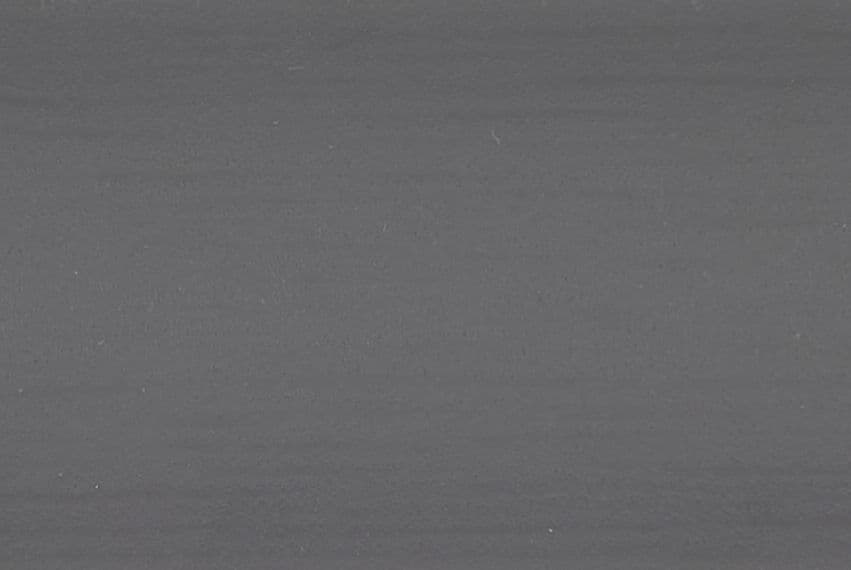 Gray fabric or paper surface with fine horizontal striations and tiny white specks; flat and static, uniformly lit, filling the frame as a close-up of a neutral textured background.