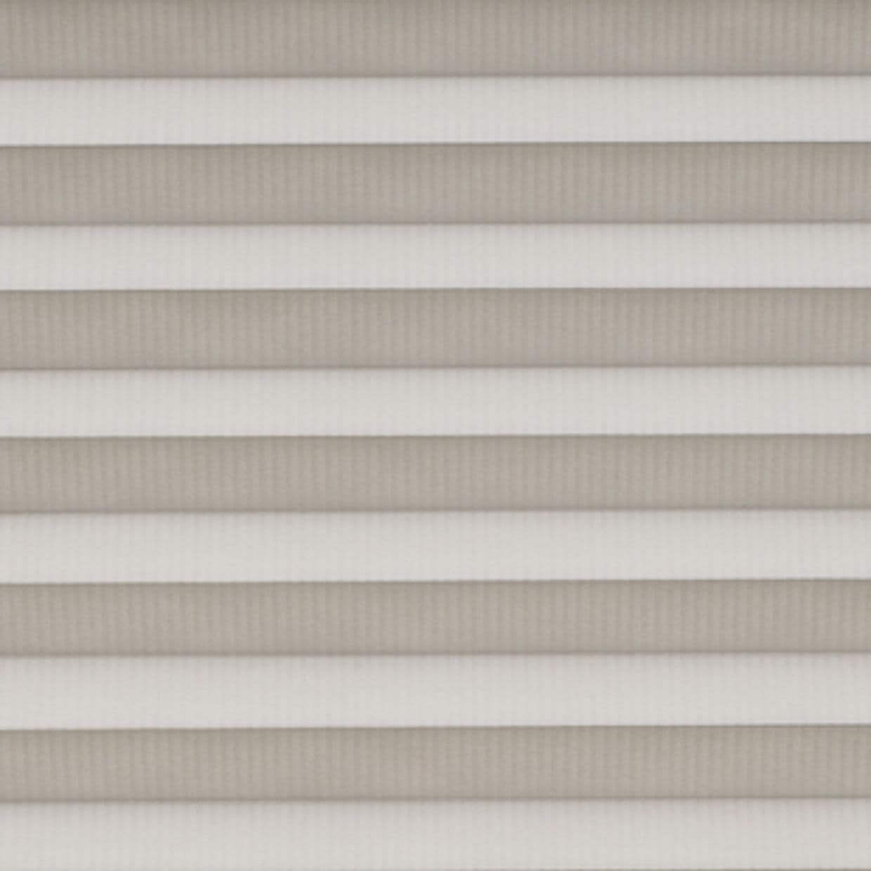 Horizontal pleated cellular shades fully lowered across the window, their alternating light-and-dark bands filtering soft daylight, filling a neutral-toned interior with diffused, even illumination.