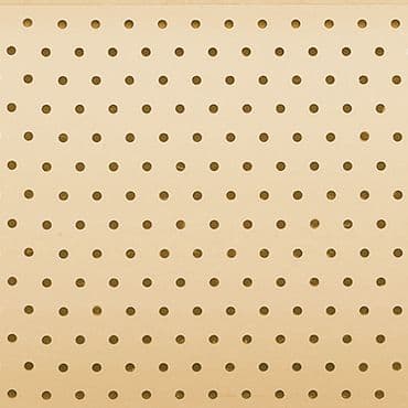 Beige perforated pegboard panel with evenly spaced circular holes fills the frame; static, serving as a plain, neutral backdrop under soft, even lighting.