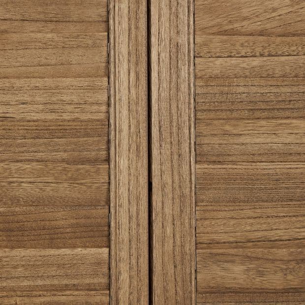 Two vertical wooden cabinet doors meet at a narrow central gap, showing horizontal grain and knotty texture; close-up, warm even lighting, no hardware visible.