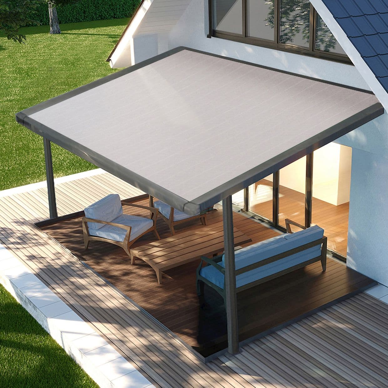 Large rectangular fabric awning, mounted to the house and supported by two front posts, fully extended shading the deck; patio seating on wooden floor beside sliding doors, sunlit lawn beyond.