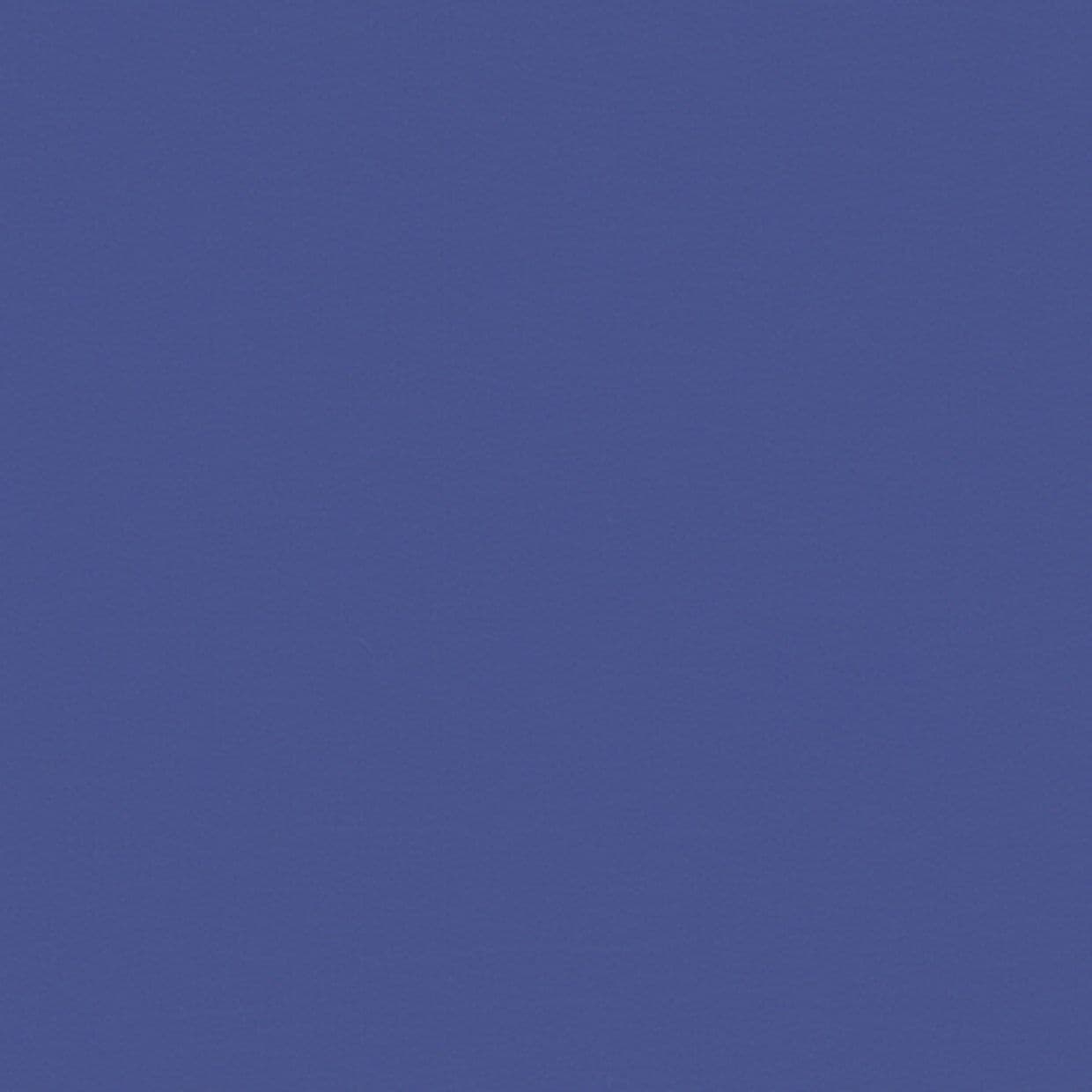 Solid muted blue textured surface (wall or fabric) centered in frame; uniformly displayed, showing subtle grain; evenly lit with no discernible objects, shadows, or surrounding context.