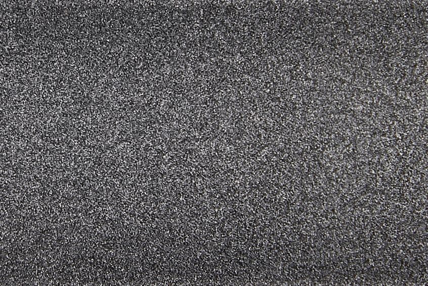 Fine-grained dark gray textured surface, densely speckled and rough, filling the entire frame; close-up macro view with even diffuse lighting and no discernible surroundings.