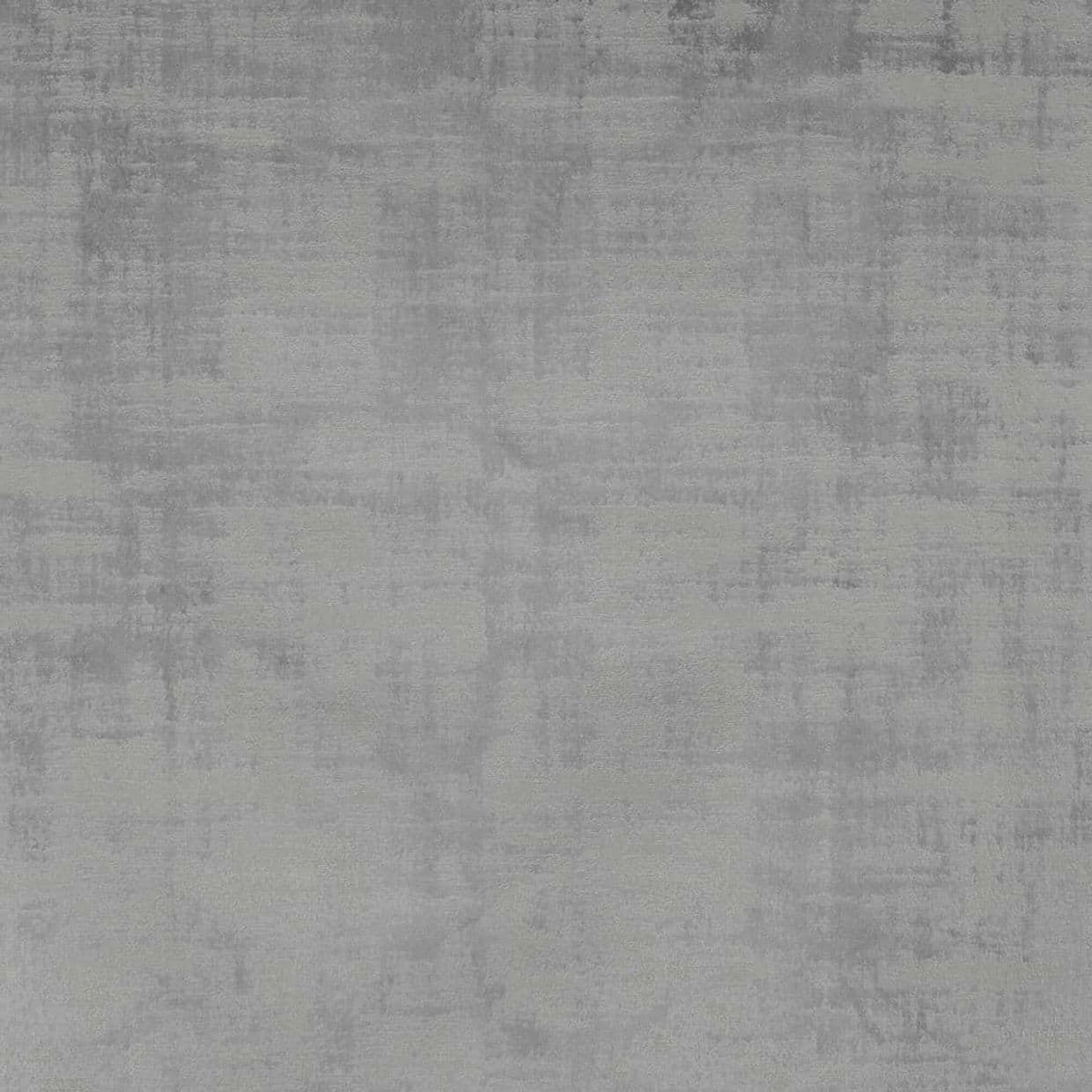 Gray, mottled fabric-like surface covering the entire frame, showing soft uneven shading and faint horizontal streaks; flat, neutral backdrop with even lighting and no visible objects.