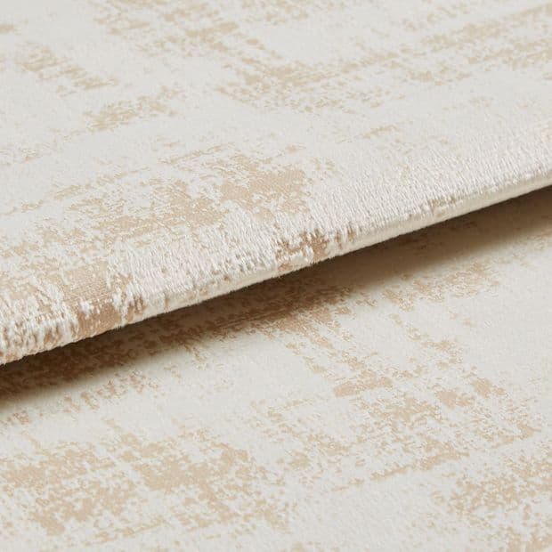 Crushed-velvet fabric with beige abstract patternâ€”folded and overlapped to reveal nap and edge; close-up, studio-lit view emphasizing soft texture and subtle sheen.