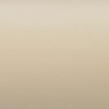 Smooth beige wall covering the entire frame, showing subtle texture and faint gradient, illuminated by soft even ambient light with no visible fixtures or furnishings.