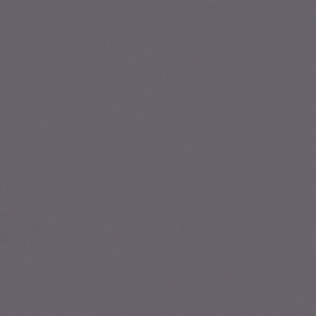 Solid matte gray textured wall filling the frame, uniformly lit and stationary, suggesting an interior surface with soft even lighting and no visible fixtures, furniture, or view.