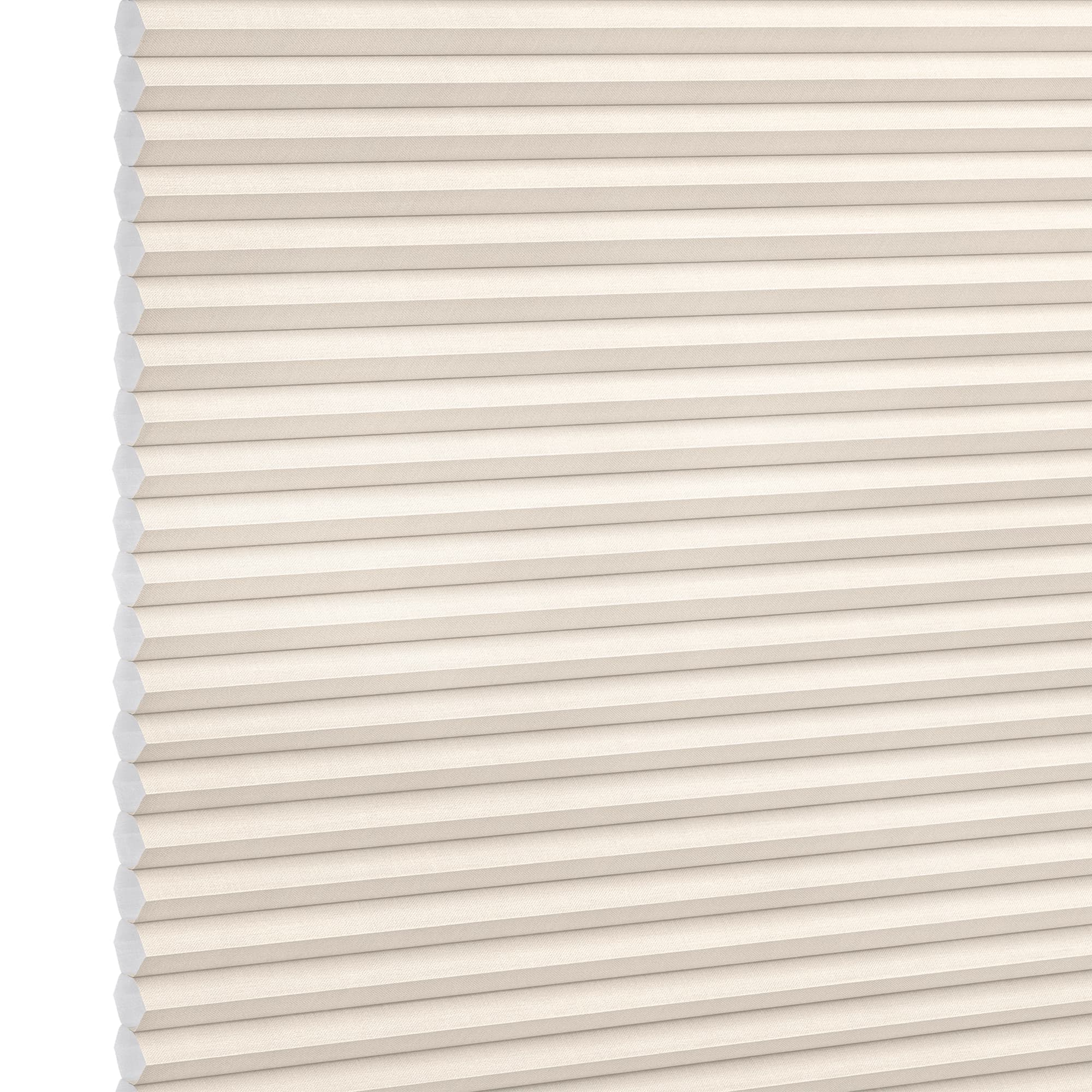 Cream honeycomb (cellular) window shade with horizontal pleats and visible hexagonal cells, fully lowered and closed, softly diffusing light; photographed as a studio product shot with neutral background.