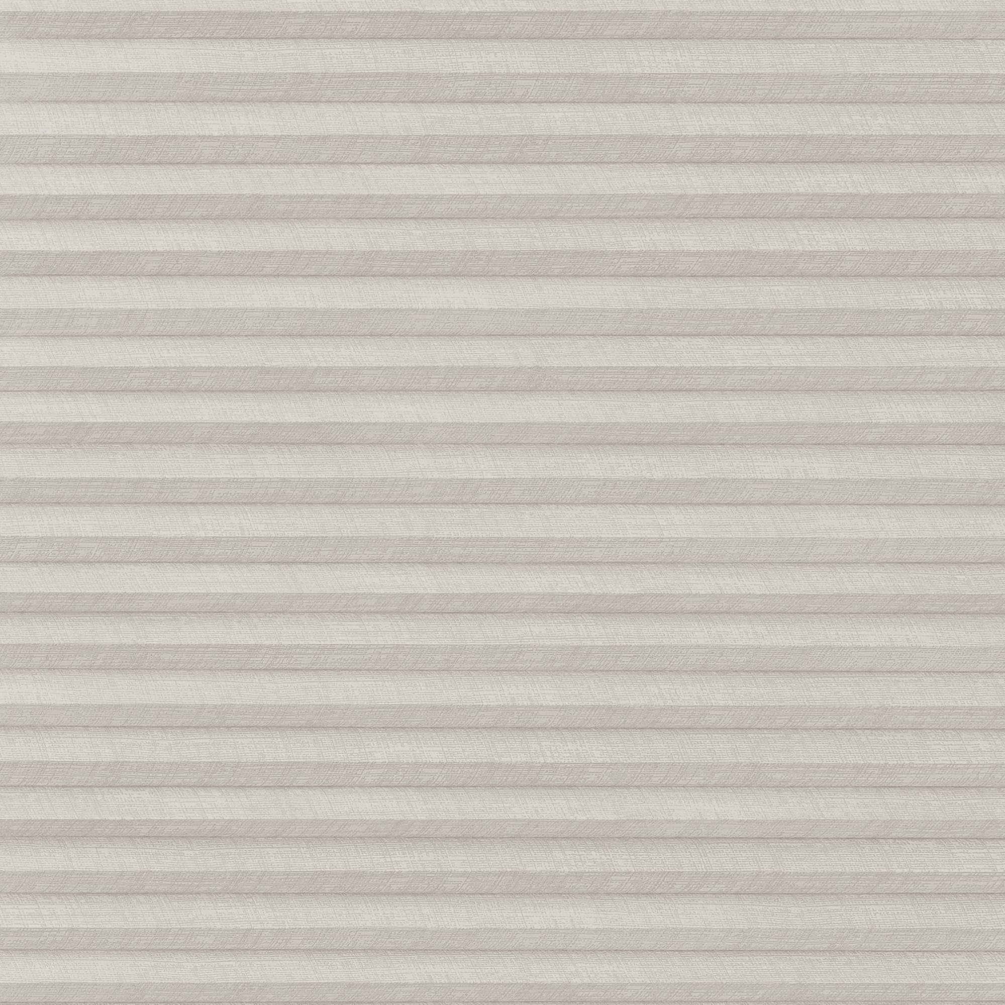 A closed light-gray pleated cellular blind with subtle linen texture, filtering and diffusing light evenly, covering a window within a neutral, softly lit interior.