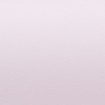 Pale pink, lightly stippled wall surface displaying a subtle textured finish; uniformly lit and filling the frame, with no visible fixtures or furniture, suggesting a neutral, minimal interior background.