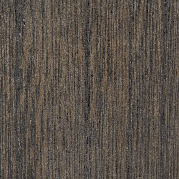 Dark wood veneer panel with fine vertical grain patterns; stationary, displaying subtle bark-like striations; close-up view under even lighting, likely a tabletop or cabinetry surface.