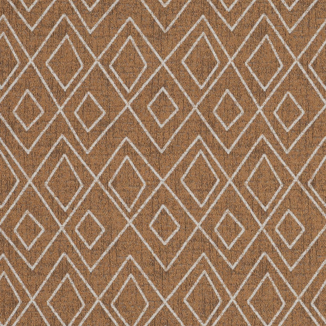 Brown woven rug with repeating white double-diamond outlines, lying flat and covering a floor; even diffuse lighting highlights its textured, symmetrical pattern, no furniture visible.