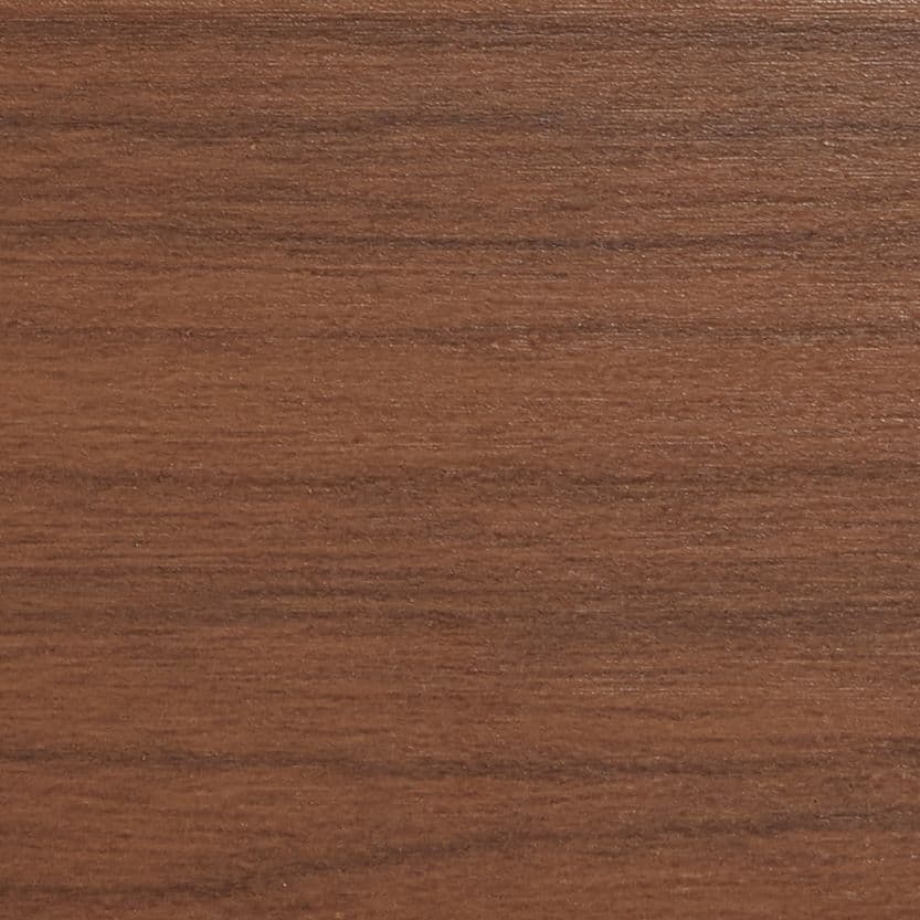 Horizontal walnut veneer panel filling the frame, displaying fine straight grain and subtle sheen; resting flat as a tabletop or shelf surface in soft, even indoor lighting.