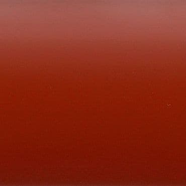 Glossy red panel, smooth and unadorned, displaying a subtle vertical gradient from darker at bottom to lighter at top and faint tiny speckles; close-up, evenly lit, minimal composition.