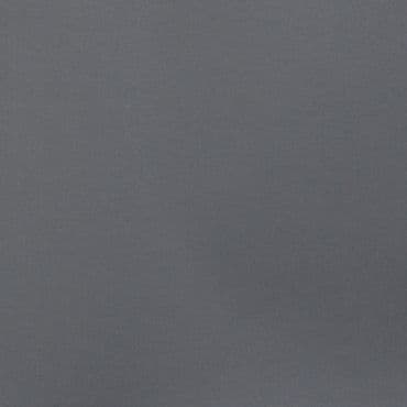 Gray textured fabric panel filling the frame, lying flat and unwrinkled, evenly lit neutral surface with subtle darker shading toward the bottom-right.